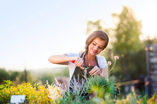 Professional gardener at work in a Pinner garden preparing tools