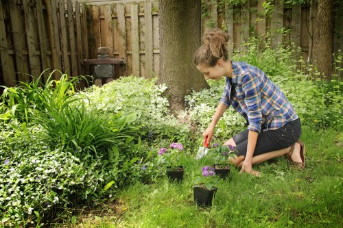 Gardener Pinner tending to a compost heap